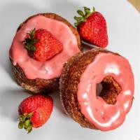Strawberry · Layered donut topped with strawberry frosting.