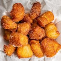 Box Of Cronut Holes · Layered donut holes tossed in cinnamon sugar