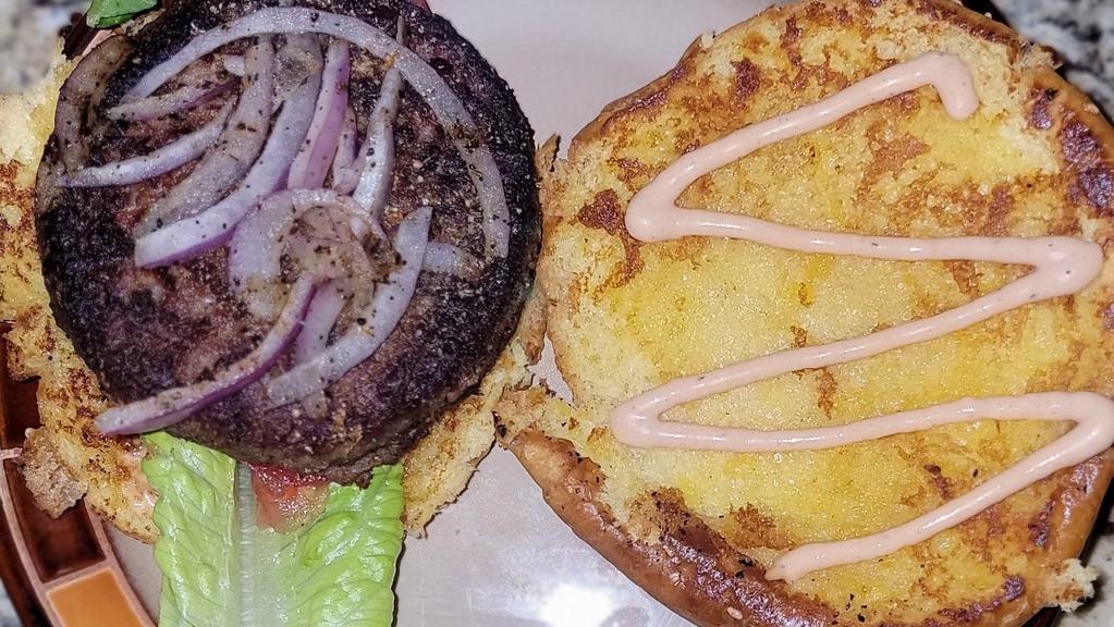 Beyond Burger + Fries · Grilled Plant Based Burger topped with Grilled Red Onions, Lettuce, Tomato served on a Toasted Bun