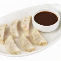Chicken Dumplings · Steamed dumplings filled with chicken, cabbage, shallots, ginger and scallions.