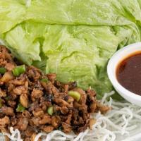 Signature Chicken Lettuce Wraps · House-ground chicken with shiitake mushrooms, scallions, water chestnuts, and garlic. Wok-to...
