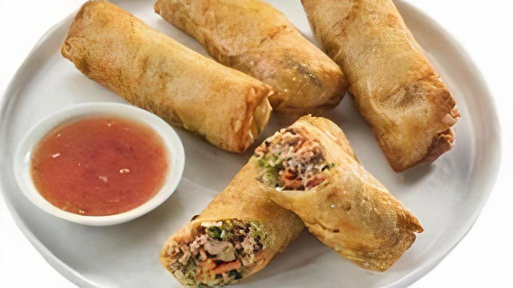 Chicken Egg Rolls · Hand-rolled, crispy egg rolls filled with seasoned chicken, cabbage, black mushrooms, carrots and scallions. Served with a sweet chili sauce.