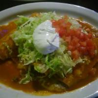 Enchiladas Supreme · One shredded chicken, one cheese, one bean and one ground beef enchilada drizzled with our e...