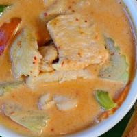 Red Curry · Red curry paste in coconut milk with green bean, bamboo shoot, eggplant and basil. Spicy.