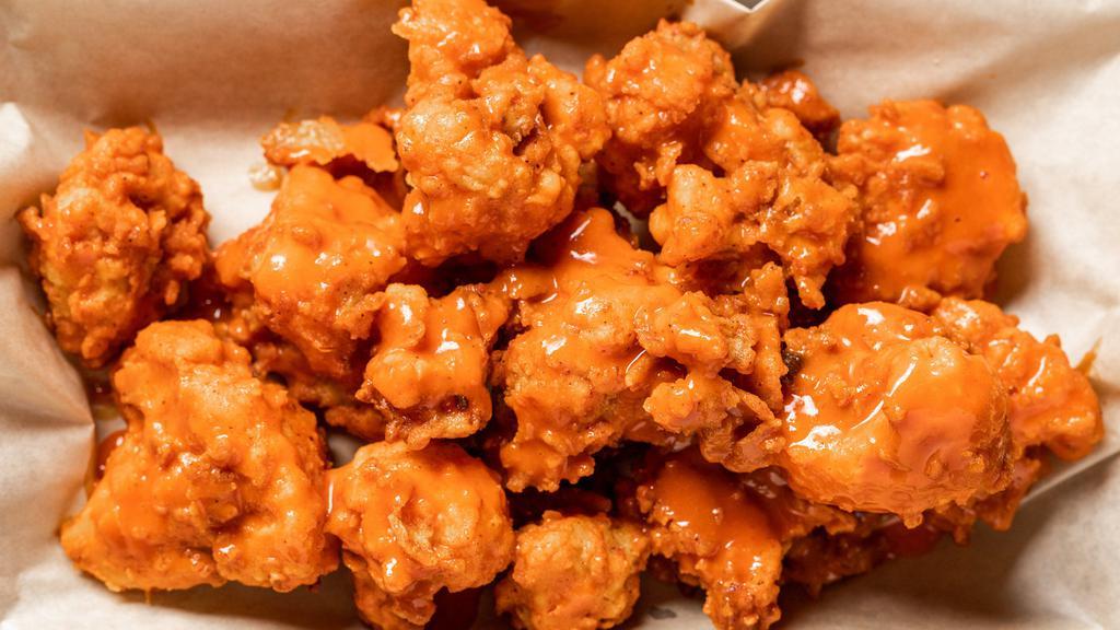 Buffalo Cauliflower · Vegetarian. Battered and fried cauliflower tossed in buffalo with ranch or blue cheese.