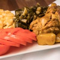 Curry Chicken · simmered in our famous Jamaican curry w/ vegetables