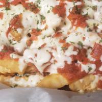 Pepperoni Pizza Fries · French fries topped with melted mozzarella cheese, Marinera sauce and Pepperoni.