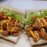 Shrimp Po Boy · Breaded shrimp served with lettuce and tomato drizzled with philly's finest signature thai c...