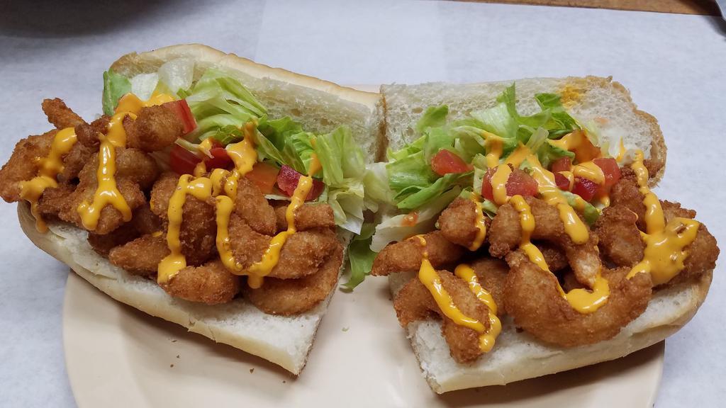 Shrimp Po Boy · Breaded shrimp served with lettuce and tomato drizzled with philly's finest signature thai chili sauce.