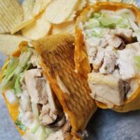 Blackened Chicken Wrap · Grilled chicken blackened with chef paul prudhommes seasoning wrapped with cheddar jack chee...