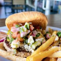 Adobo Dusted Lamb Burger · Adobo dusted Lamb Burger topped with Cucumber Salsa and Feta cheese. Little Bo Peep called l...