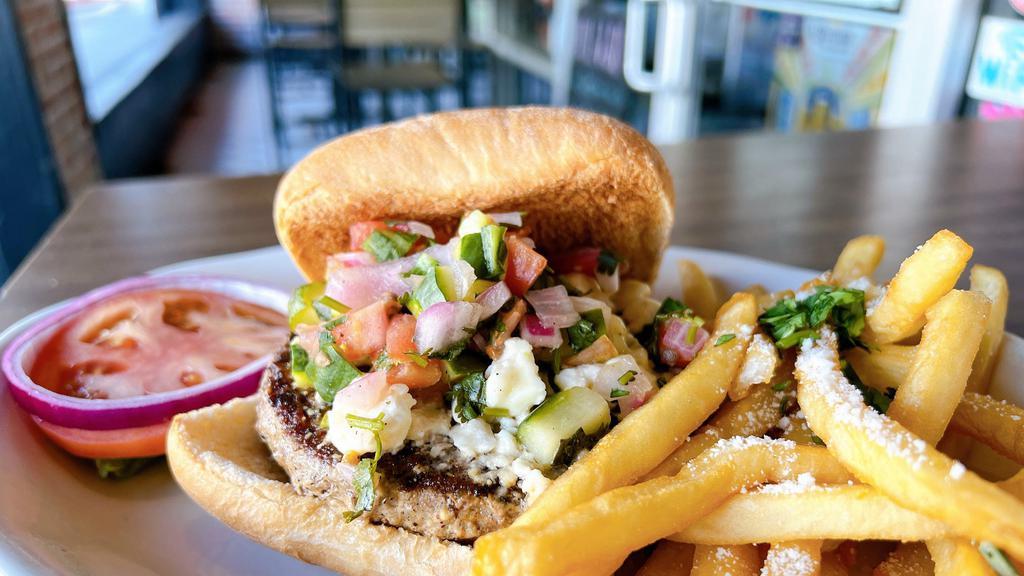 Adobo Dusted Lamb Burger · Adobo dusted Lamb Burger topped with Cucumber Salsa and Feta cheese. Little Bo Peep called looking  for her lamb……shhhhh. Don’t say a word.