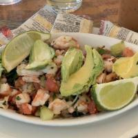 Shrimp Ceviche · Shrimp with a blend of onions, cucumbers, cilantro, lime, tomatoes and slices of avocado.