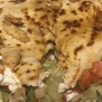Grilled Chicken Quesadilla · Served with a side of lettuce, sour cream, and pico de gallo.