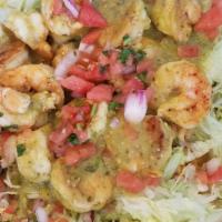 Shrimp Salad · Grilled shrimp served on a bed of rice, topped with lettuce, avocado slices, and fresh lime ...