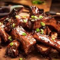 Asian Spare Ribs · Wok seared and tangy Asian Bbq sauce.