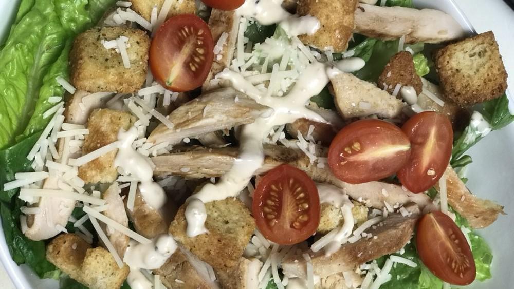 Chicken Caesar Salad · Romaine lettuce, croutons, Parmesan cheese and cherry tomatoes.