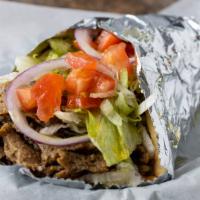 Gyro Pita · Seasoned grilled beef and lamb slices wrapped in a pita with lettuce, tomato, onion and tzat...