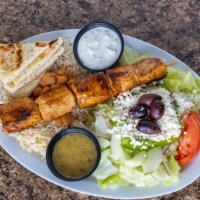 Chicken Souvlaki Platter · Marinated grilled chicken breast souvlaki served with  Greek salad, pita bread, tzatziki and...