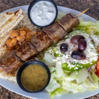 Ribeye Souvlaki Platter · Marinated grilled ribeye souvlaki served with  Greek salad, pita bread, tzatziki and choice ...