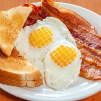 P6 - 2 Eggs & Bacon · 2 Eggs Any Style with Bacon and Buttered Toast.