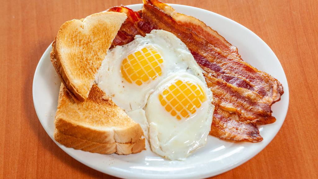 P6 - 2 Eggs & Bacon · 2 Eggs Any Style with Bacon and Buttered Toast.