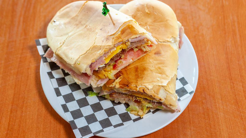 4 - Chivito Especial · Cuban Bread Toasted with Steak, Ham, Cheese, Bacon, Egg, Lettuce, Tomatoes, Potatoes Sticks, and Mayo