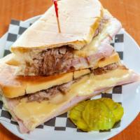 1 - Cuban Sandwich · Cuban Bread Toasted with Pork, Ham, Cheese, Pickle, Mayo, and Mustard