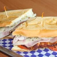 23B - Milanesa Especial · Cuban Bread Toasted with Breaded Steak or Breaded Chicken, Lettuce, Tomato, Ham, Cheese, and...