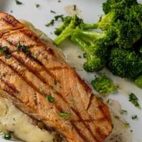 Filete De Salmon · Fresh grilled salmon. Served with mashed potatoes and seasonal vegetables.