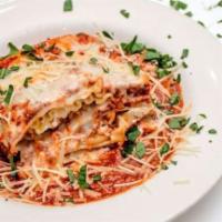 Chicken Parmesan · Our classic parmesan topped with mozzarella cheese and marinara sauce.
Served with a side of...