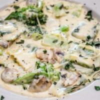 Blackened Chicken · Grilled chicken tossed with Penne in a creamy cajun cream sauce with mushrooms and peas.