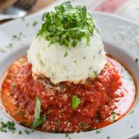Meatball · Our homemade meatball topped with tomato sauce, parmesan and ricotta cheese.
