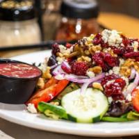 Cumare Salad · Dried cranberries, walnuts and gorgonzola over our house salad.
( Recommended dressing Raspb...