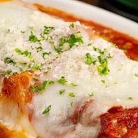 Lasagna · Lasagna pasta rolled and filled with a cheese blend, topped with mozzarella and bolognese sa...