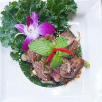 Nua Nam Tok · Medium spicy, contain shellfish, gluten-free.  Grilled beef with mint, shallots, scallions, ...