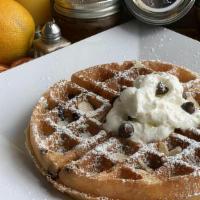 Chocolate Chip Waffle · With almonds, whip cream and powdered sugar.