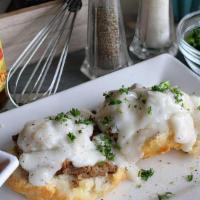 Biscuit And Gravy · Our signature biscuit topped with delicious gravy and veggie sausage crumbles, choice of ric...