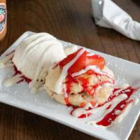Strawberry Short Cake · Honey butter biscuit topped with whipped cream and strawberries and served with ice cream.