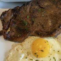 South Fulton Steak & Eggs · Grilled strip steak, two eggs, rich creamy grits, or breakfast potatoes, served with toast o...