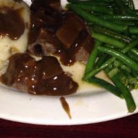 Pot Roast Platter
 · Pot roast served with homemade mashed potatoes and broccoli, topped with a pot roast gravy.