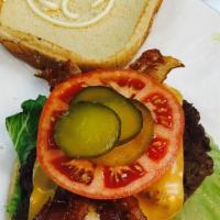 Bacon Cheese Burger · Our delicious burger served with fresh lettuce, tomato, grilled onion, and mayonnaise and to...