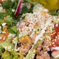 Chop Chop · AKA Bowls: Lettuce, corn, rice, beans, tomato, sour cream, cilantro sauce, chipotle sauce an...