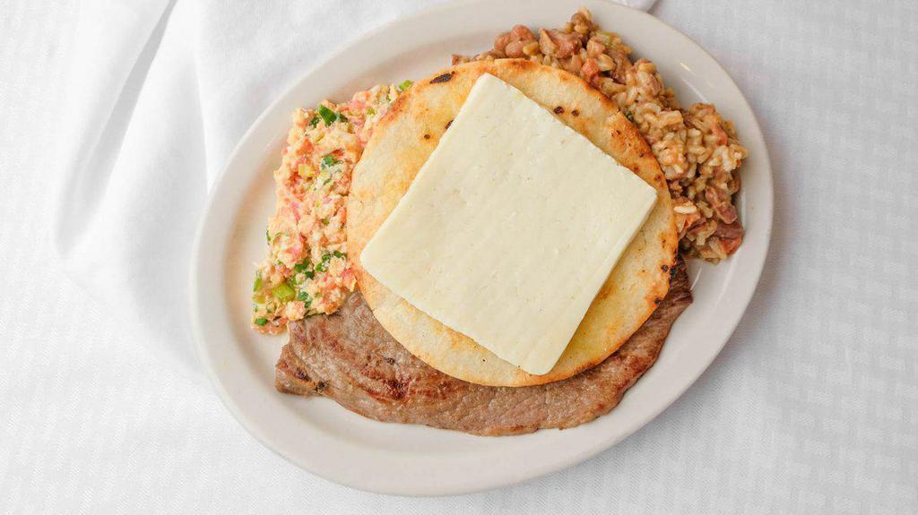 Calentado Santo Paisa · Arroz y frijoles calentados, carne a la plancha, o chicharron o chorizo y huevos al gusto y arepa con queso, and chocolate. Colombian beans mixed with rice, any style eggs, choice of protein, and corn cake topped with cheese.