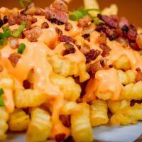 Cheddar Bacon Ranch Fries · Fresh fries coated with cheddar cheese, ranch, and bacon bites.