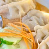 Pot Stickers · Pork filled dumplings served with Thai red curry sauce