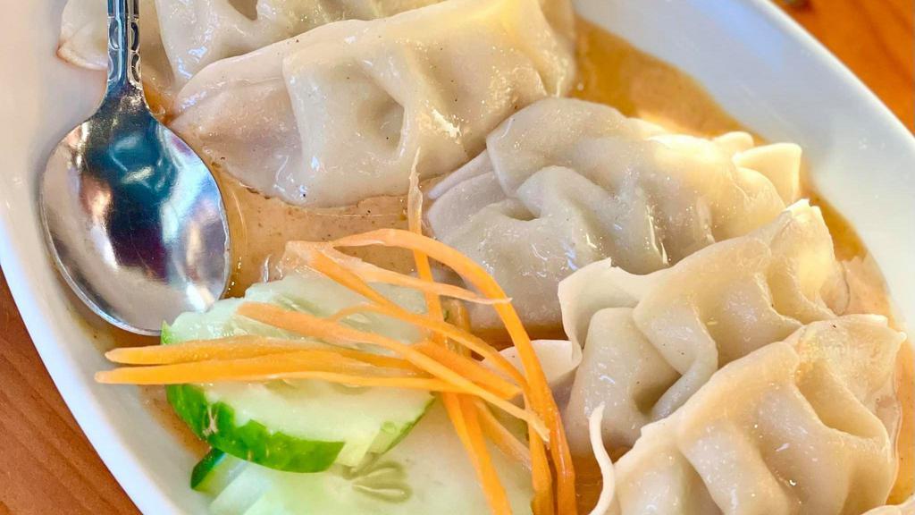 Pot Stickers · Pork filled dumplings served with Thai red curry sauce