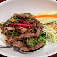 Spicy Beef Salad · Grilled marinated lean beef, tomatoes, red onions & cucumber tossed in spicy lime sauce with...