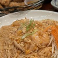 Pad Thai · Thai think rice noodles, pan fried with shrimp, chicken, tofu, peanuts, bean sprouts & egg. ...