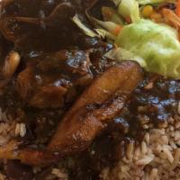 Oxtail · Choose between lunch special (smaller portion) or full dinner. both come with rice & peas (c...